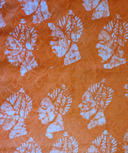 Load image into Gallery viewer, Orange Batik Fabric- Woman Mask Pattern